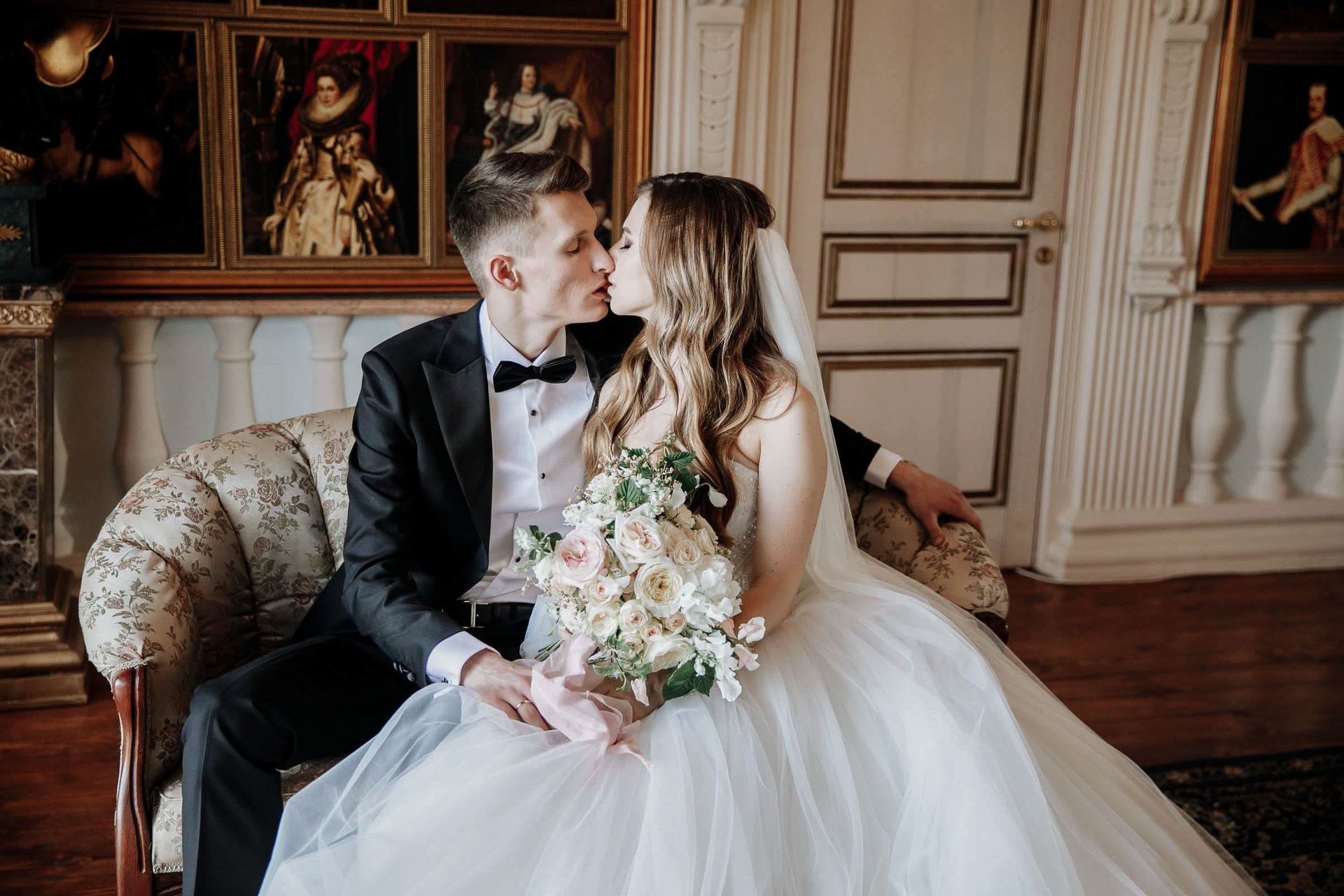 An editorial portrait of the couple sharing a kiss by Tanya Bogdan.