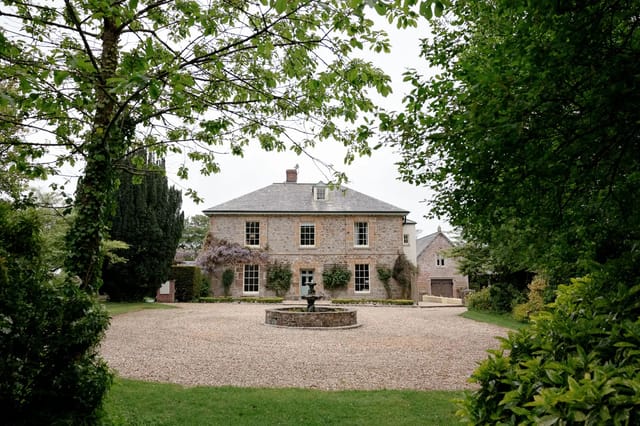Glebe Barn wedding venue in Devon, photographed during a summer wedding.