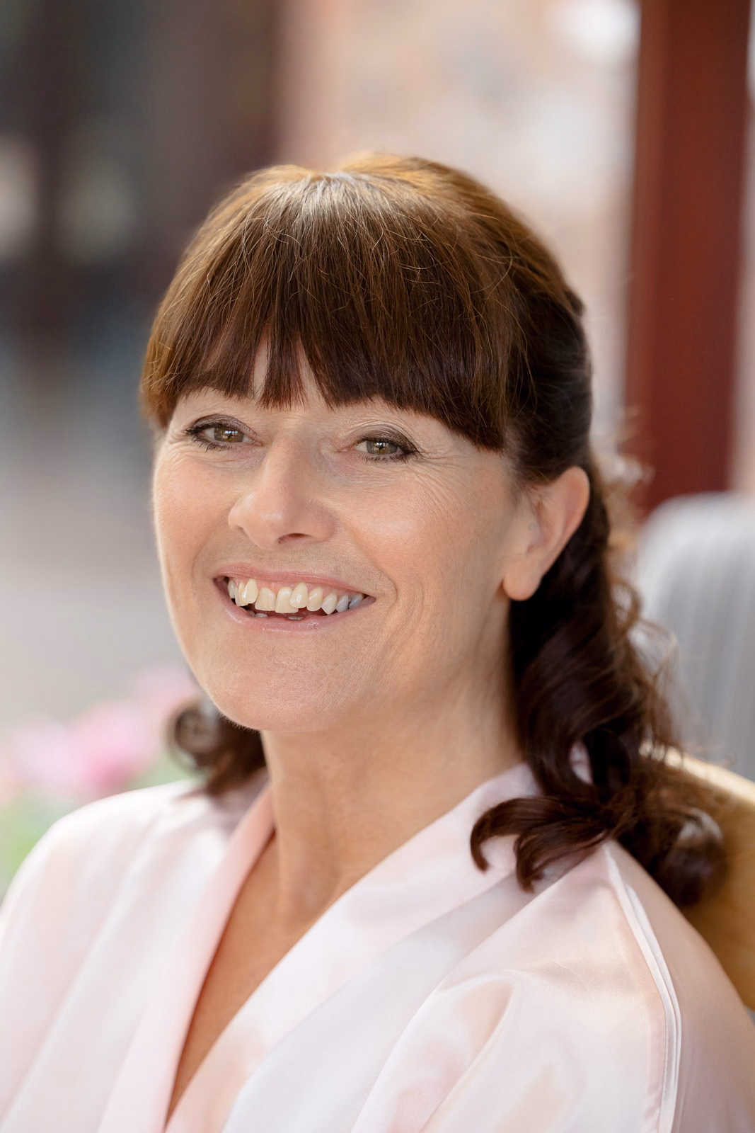 Smiling portrait in pink robe bridal prep at a Taunton farm wedding, photographed by Tanya Bogdan Photography