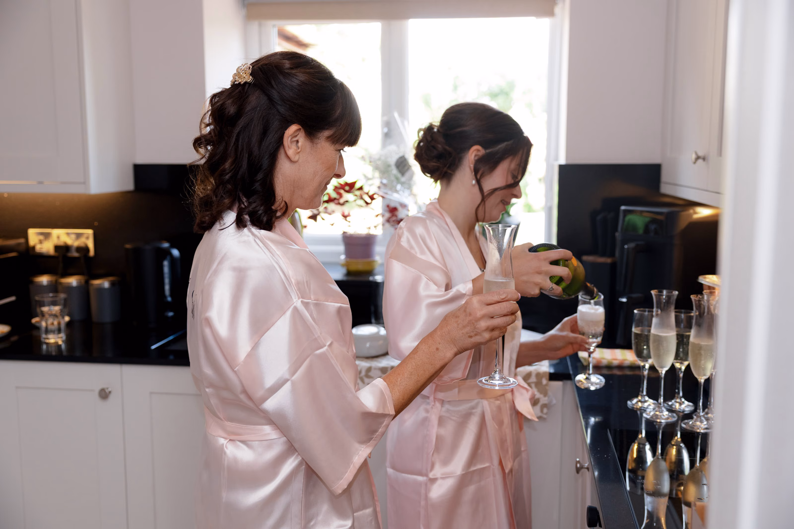 Bridesmaids champagne bridal prep at a family farm wedding in Taunton