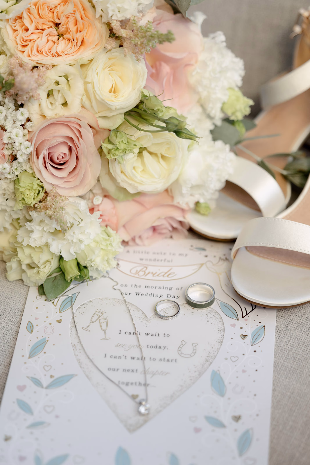 Bouquet shoes and invitation wedding details at a Taunton farm wedding, photographed by Tanya Bogdan Photography