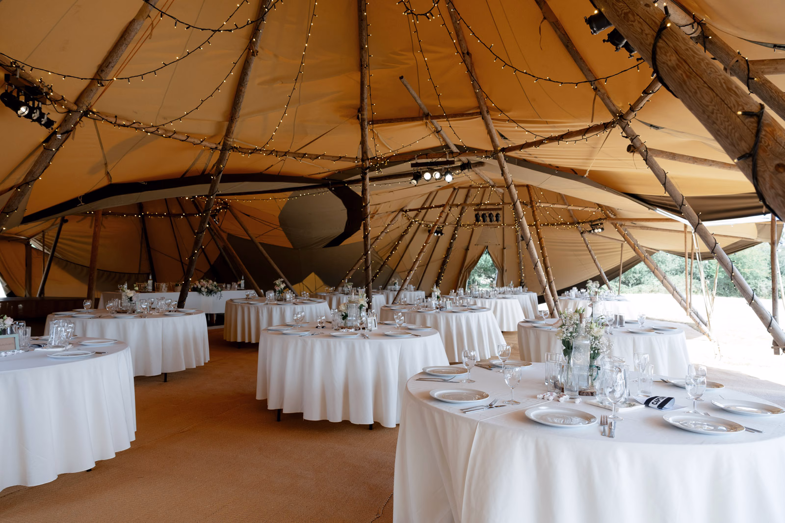 Tipi reception interior table settings at a Taunton farm wedding, photographed by Tanya Bogdan Photography