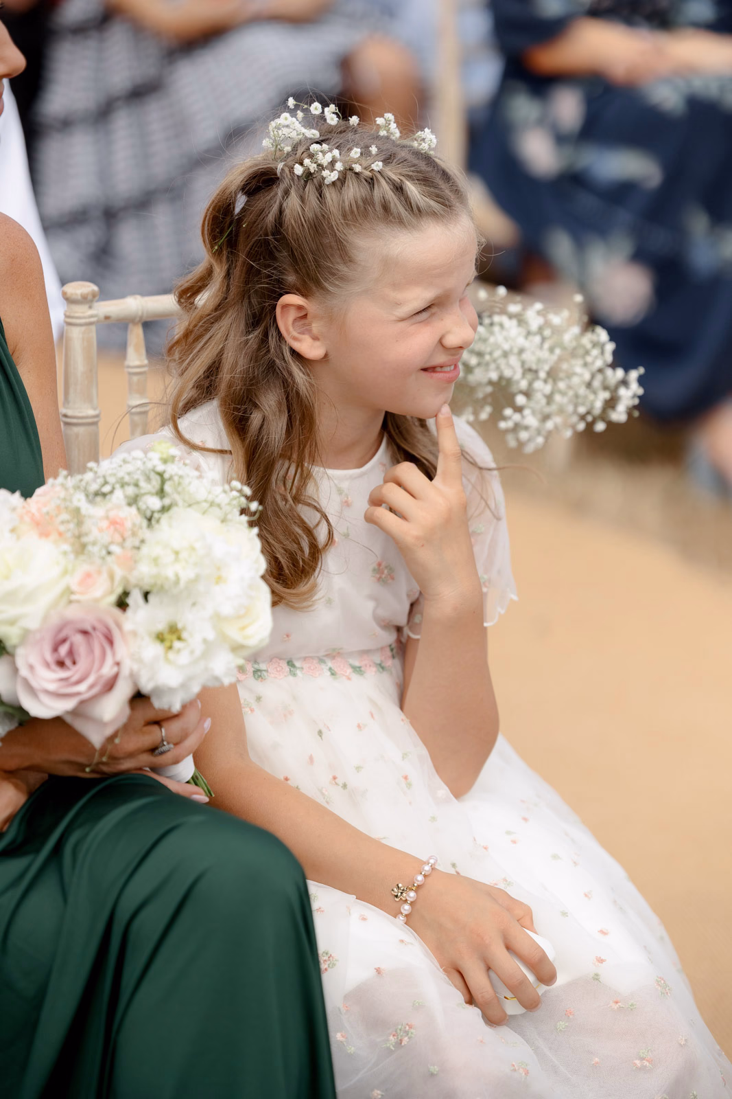 Flower girl laughing during ceremony at a countryside wedding in Taunton, Somerset
