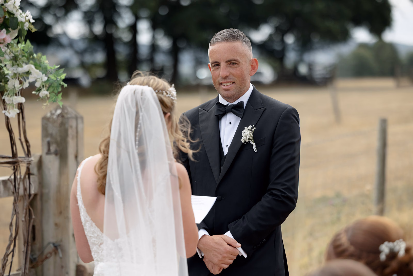 Bride and groom exchanging vows close-up at a countryside wedding in Taunton, Somerset