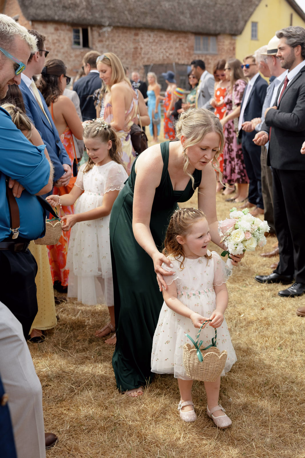 Flower girls and bridesmaid after ceremony at a family farm wedding in Taunton
