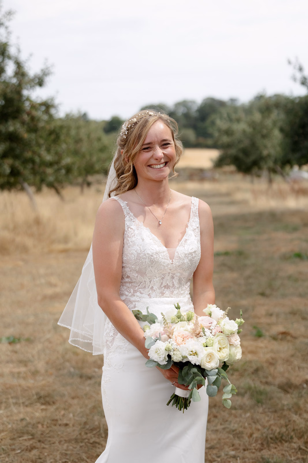 Bride portrait bouquet orchard at a countryside wedding in Taunton, Somerset