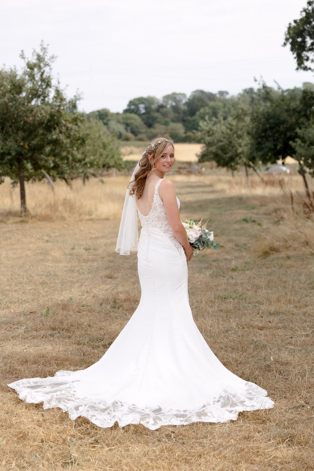 Bride dress train back view at a Taunton farm wedding, photographed by Tanya Bogdan Photography