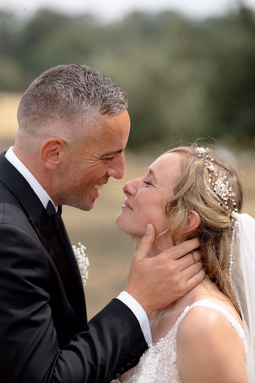 Bride and groom nose to nose at a countryside wedding in Taunton, Somerset