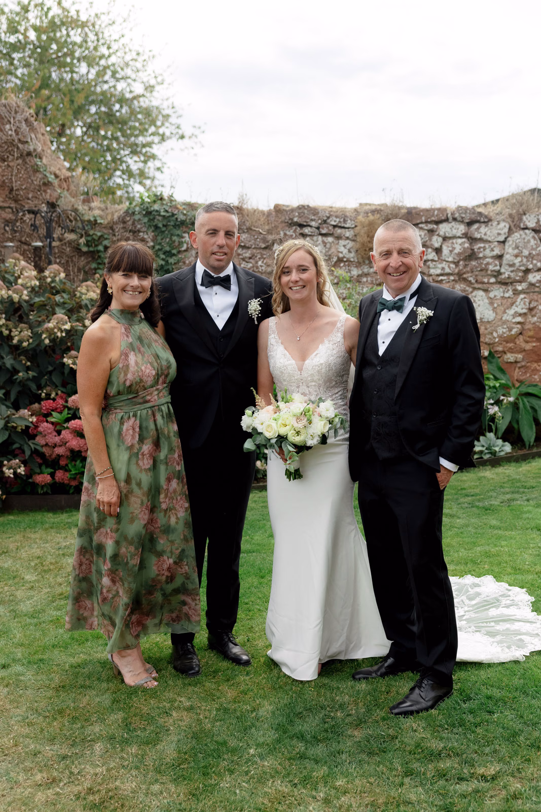 Family group photo walled garden at a family farm wedding in Taunton