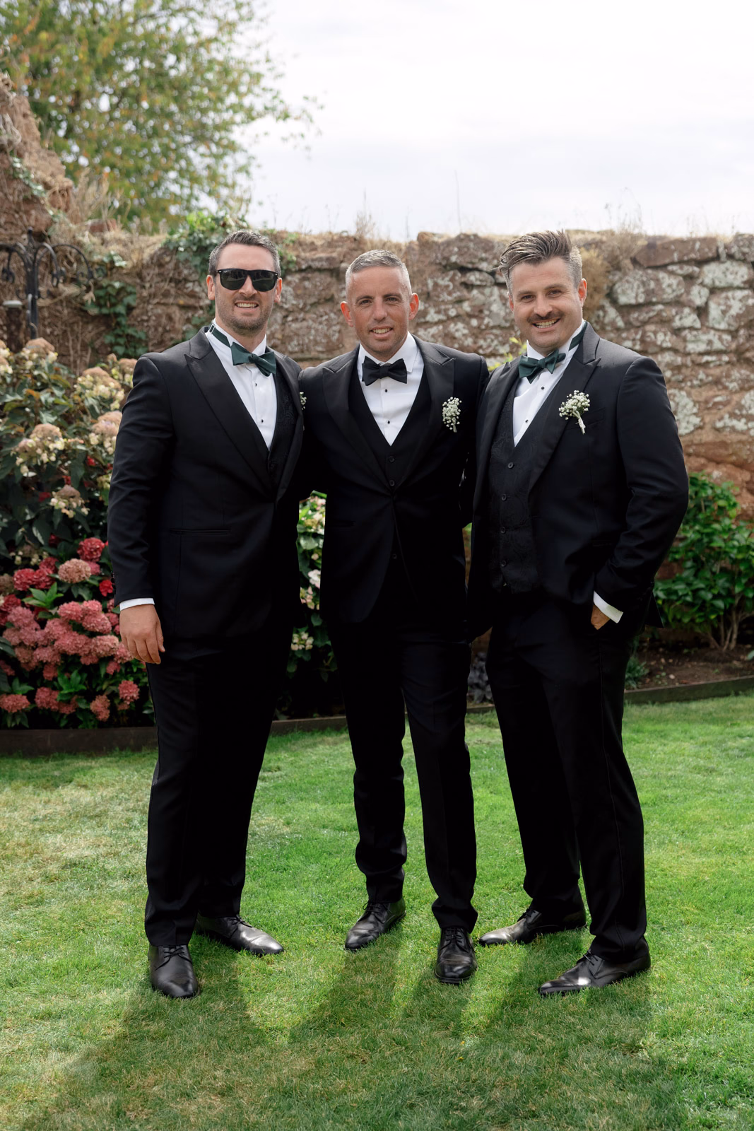 Groom and groomsmen walled garden at a Taunton farm wedding, photographed by Tanya Bogdan Photography