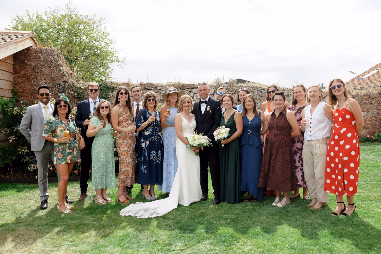 Wedding guests group photo garden at a family farm wedding in Taunton