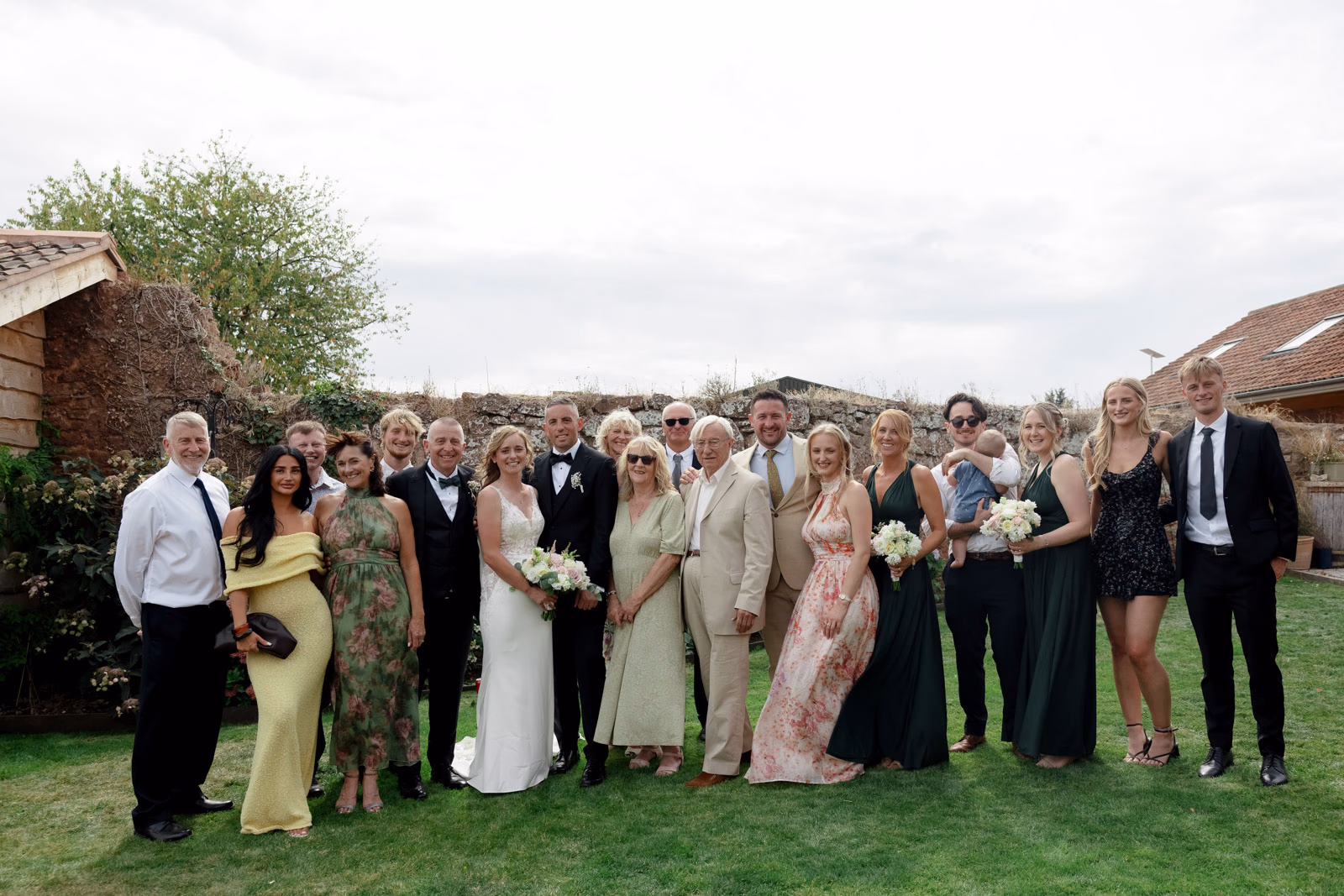 Group photo wedding guests formal at a family farm wedding in Taunton