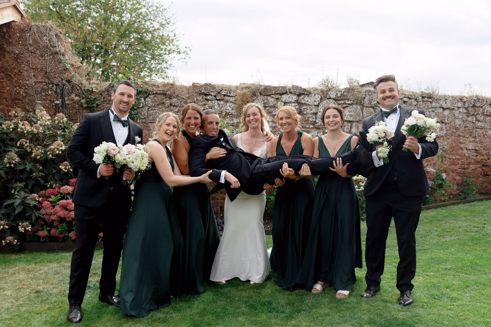 Bridal party fun group photo at a family farm wedding in Taunton