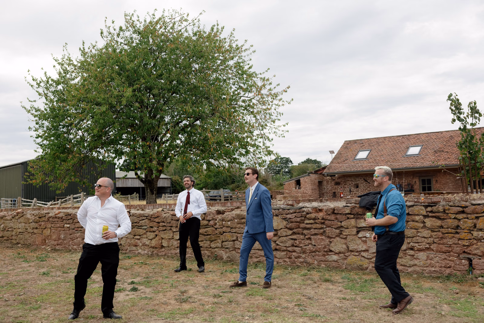 Guests playing lawn games farm at a Taunton farm wedding, photographed by Tanya Bogdan Photography