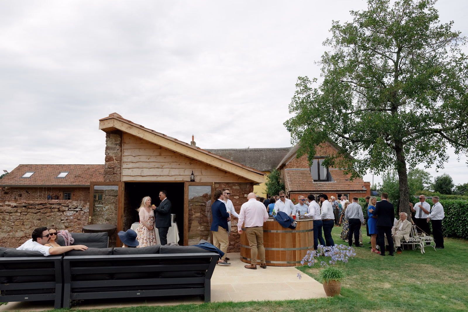 Outdoor lounge farm guests at a countryside wedding in Taunton, Somerset