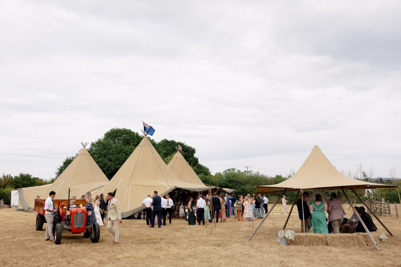 Tipi wedding view tractor guests at a countryside wedding in Taunton, Somerset
