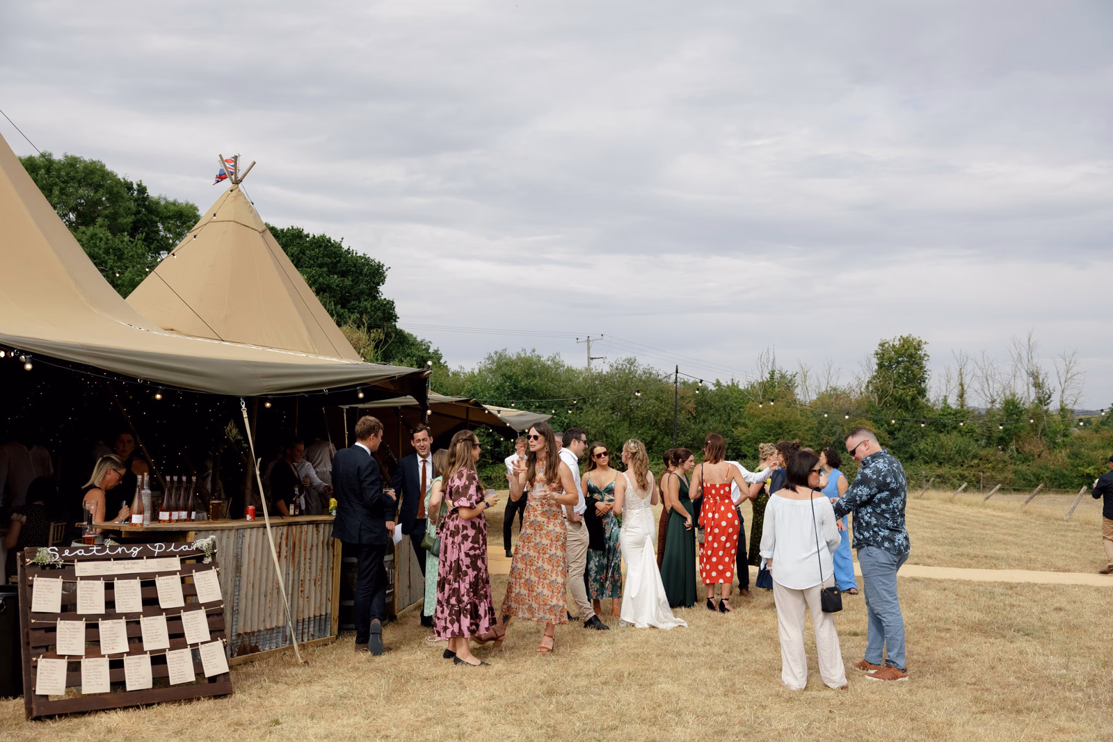 Seating plan tipi guests drinks reception at a Taunton farm wedding, photographed by Tanya Bogdan Photography