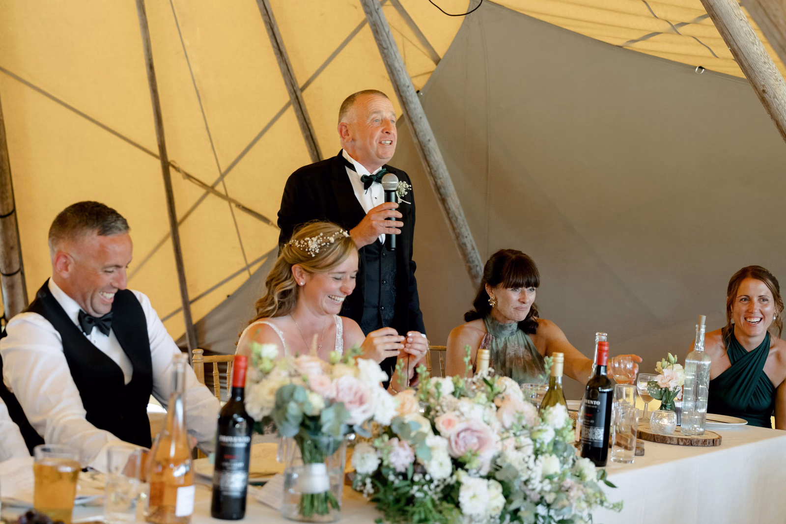 Speech wedding breakfast top table at a family farm wedding in Taunton