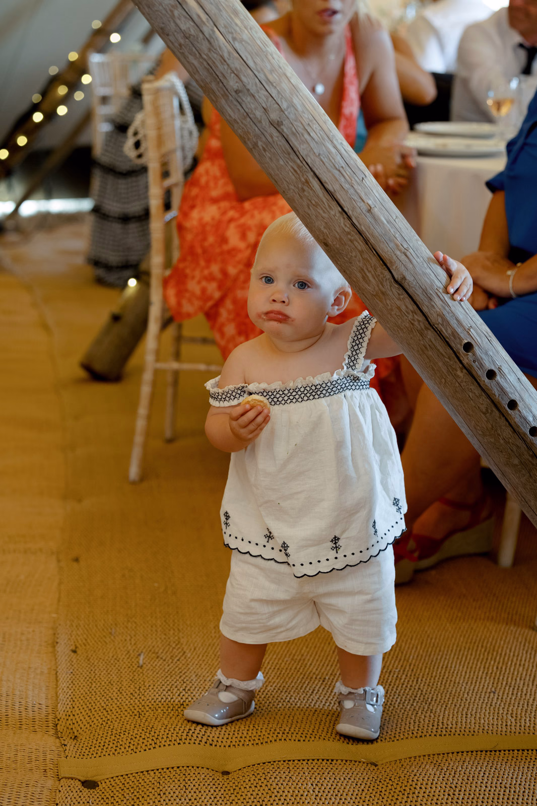 Toddler exploring tipi at a Taunton farm wedding, photographed by Tanya Bogdan Photography