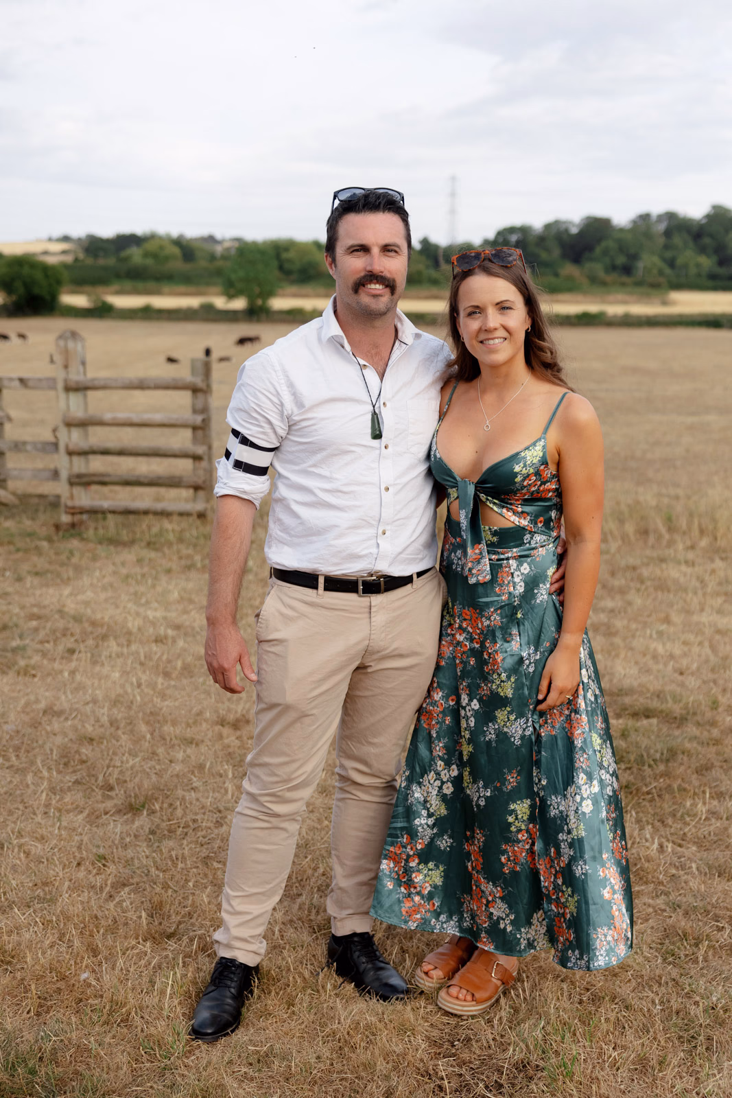 Guest couple portrait evening field at a Taunton farm wedding, photographed by Tanya Bogdan Photography
