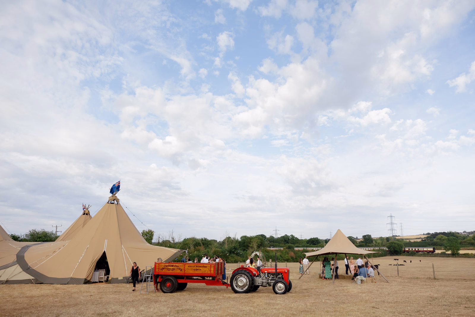 Tractor and tipi evening at a countryside wedding in Taunton, Somerset