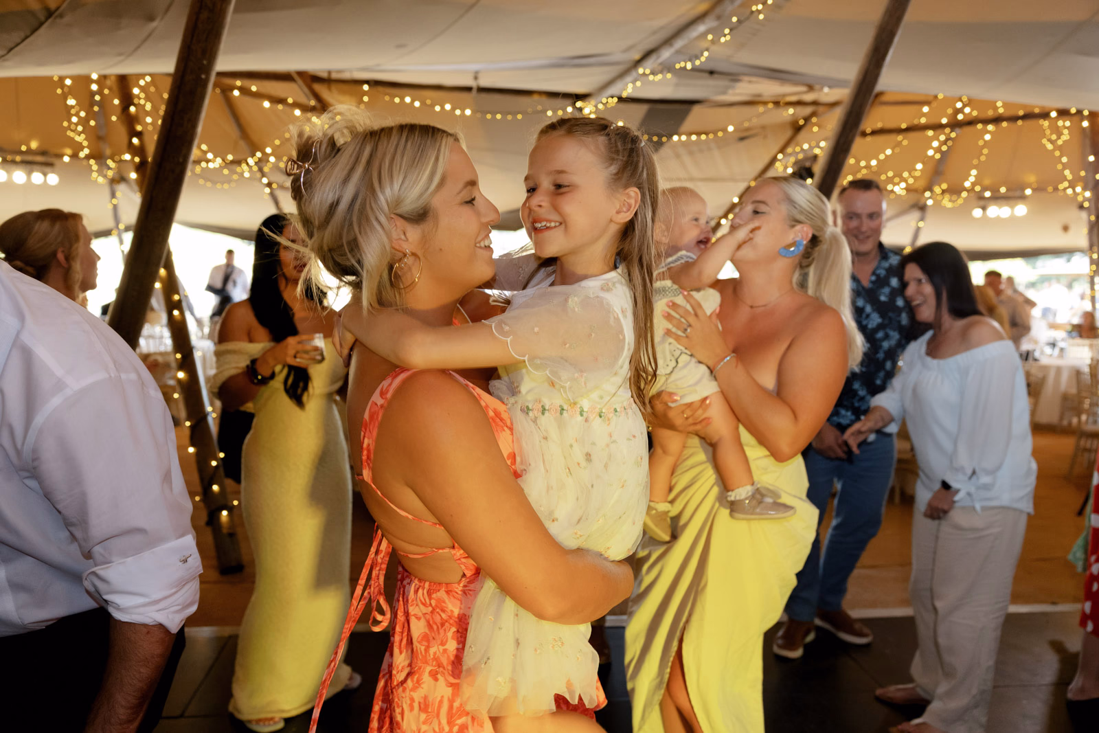 Guests hugging on dancefloor at a countryside wedding in Taunton, Somerset