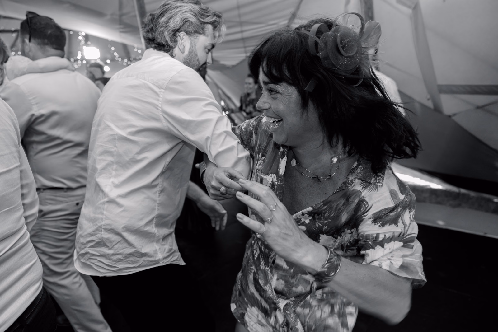 Guests dancing black-and-white at a family farm wedding in Taunton