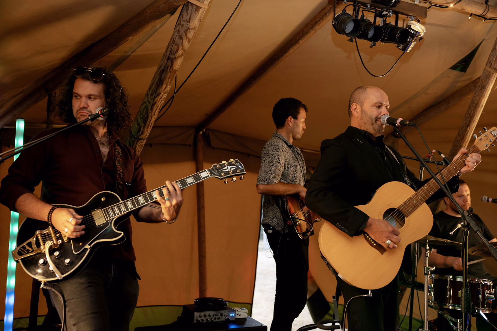 Live band playing in tipi at a Taunton farm wedding, photographed by Tanya Bogdan Photography