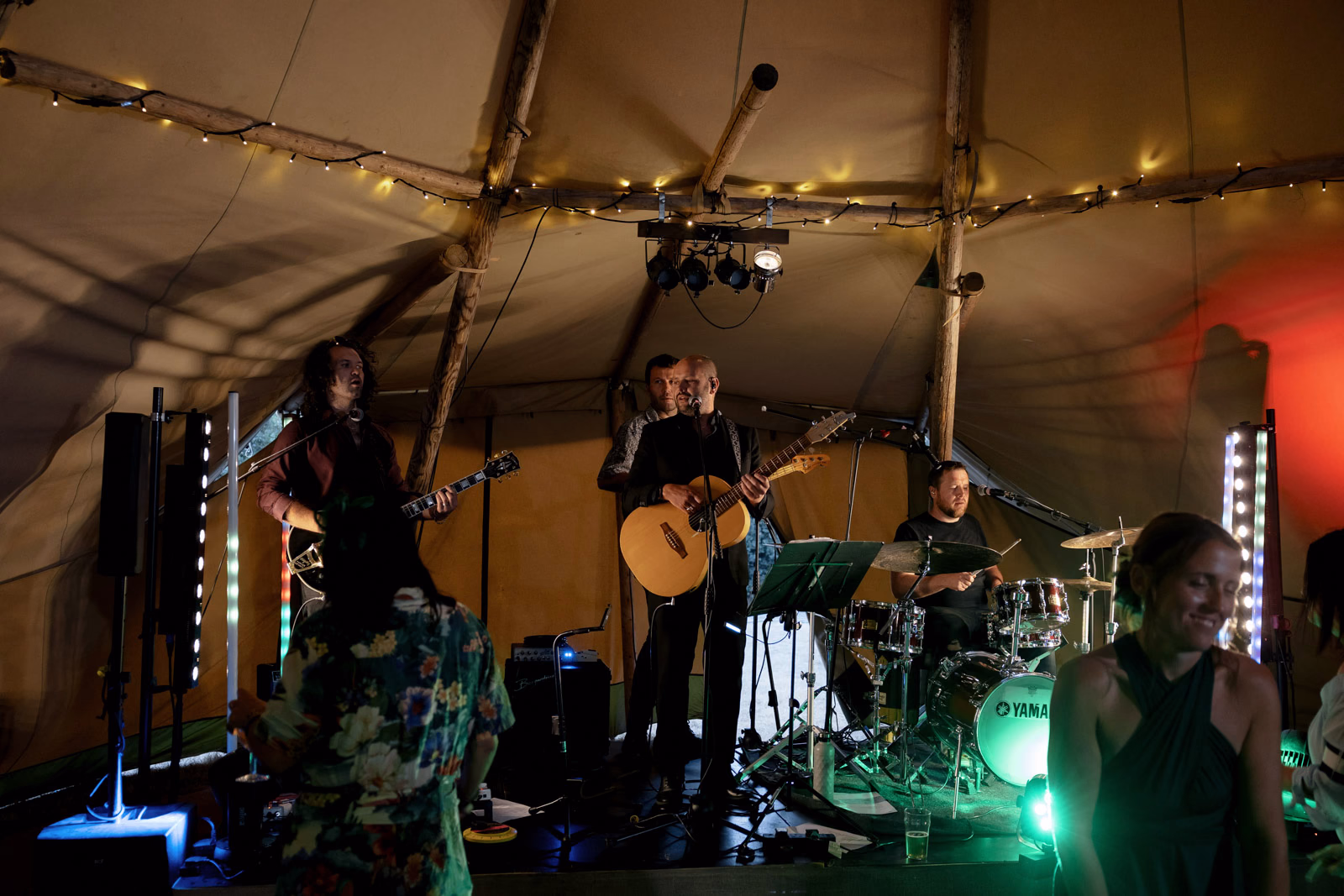 Live band performing tipi at a Taunton farm wedding, photographed by Tanya Bogdan Photography