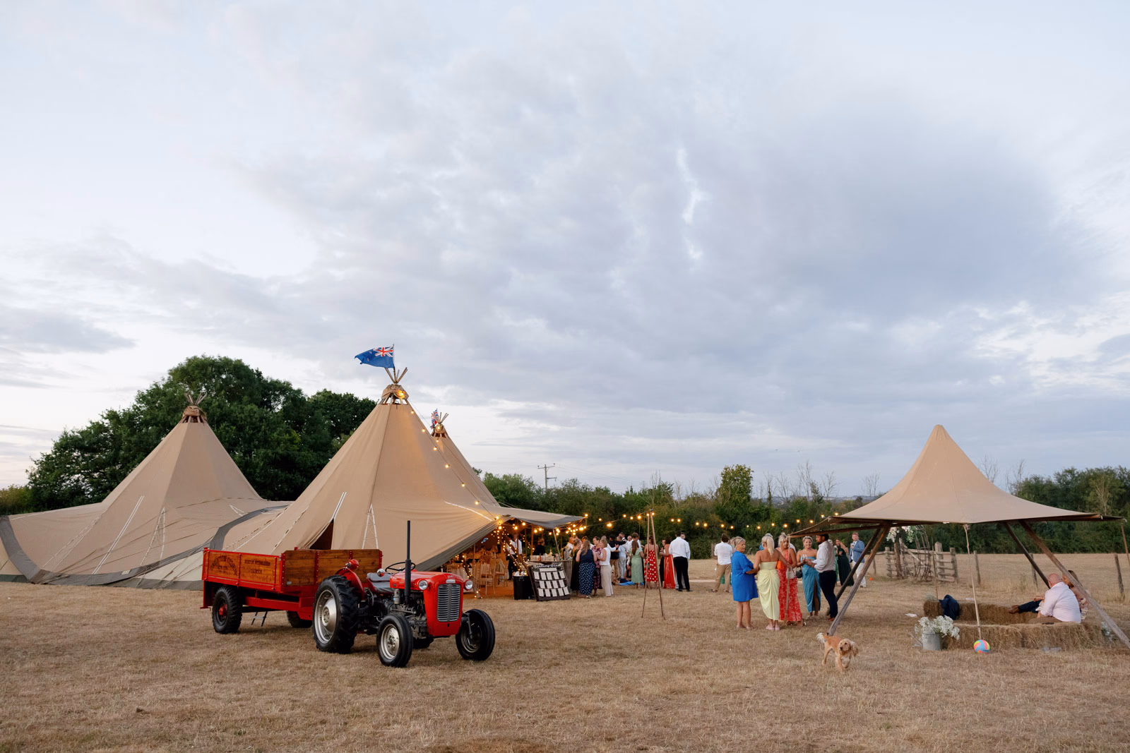 Tipi dusk tractor guests at a countryside wedding in Taunton, Somerset