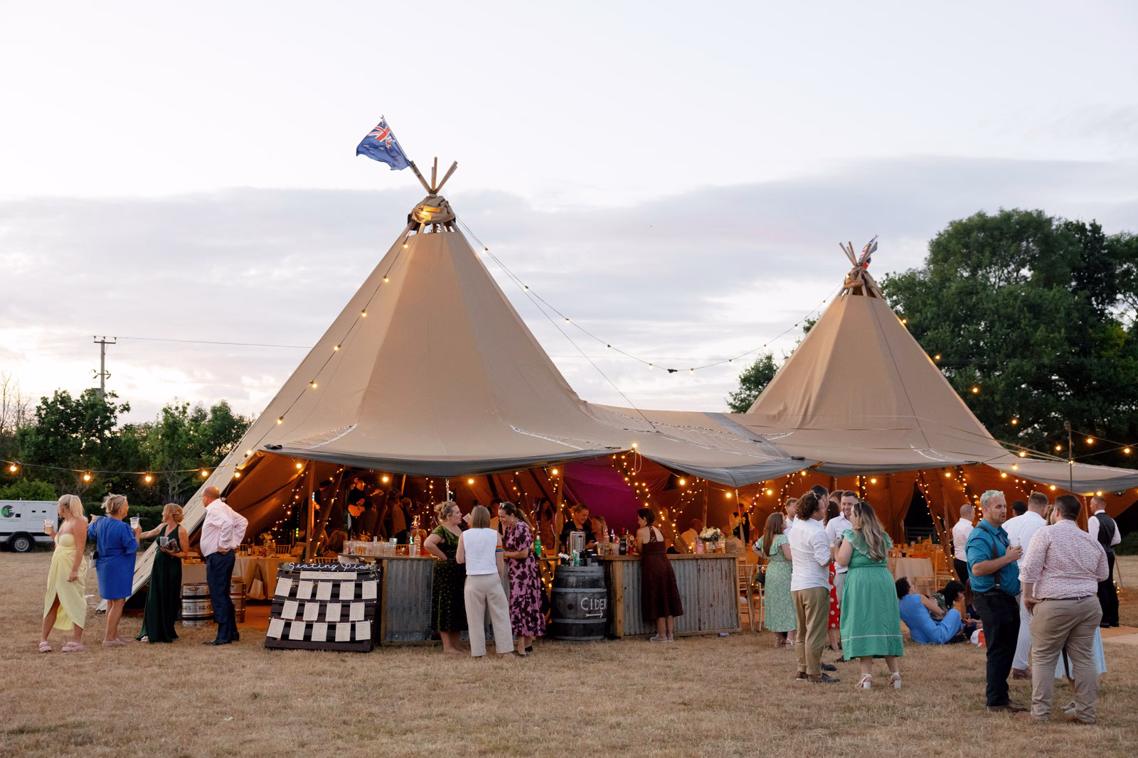 Tipi lit up evening bar at a Taunton farm wedding, photographed by Tanya Bogdan Photography
